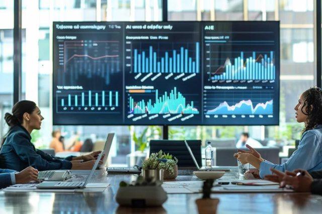 a sleek urban office space showcases a diverse team of professionals engaged in a dynamic discussion around a modern conference table, with digital graphs and trends about the housing market prominently displayed on a large screen behind them.